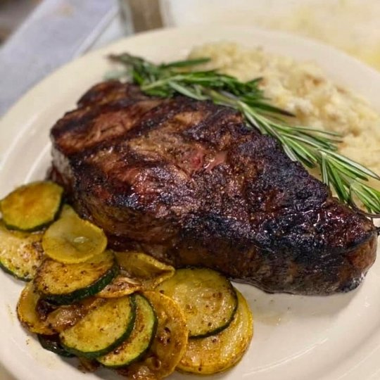 Steak dinner dinner served with vegetables and mashed potatoes. Served at Happy Valley LIVE restaurant