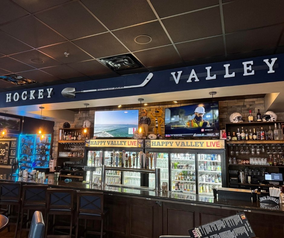Hockey Valley 5x4 Sports Bar in State College, PA. Hockey Valley sign above the full bar